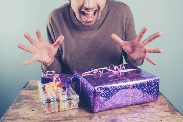 Young man excited about his presents — Stock Photo, Image