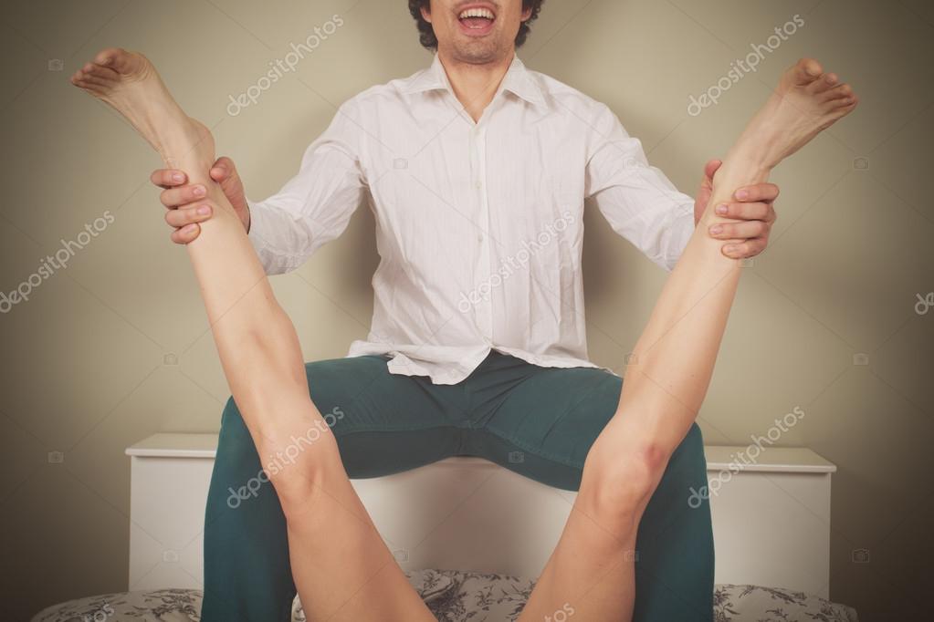 Legs Soread Happy man spreading legs of woman Stock Photo by ©lofilolo 60893533