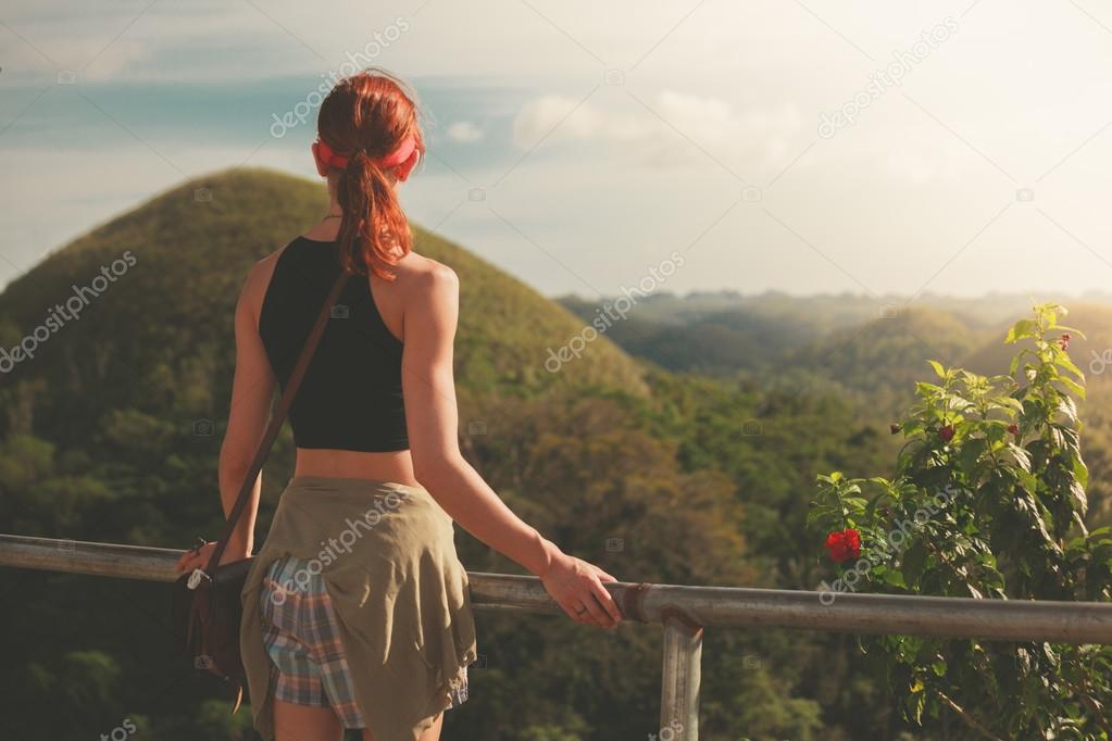 Woman admiring view of chocolate hils in Philippines