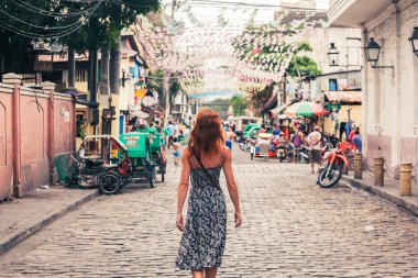 Young woman walking in Manila clipart