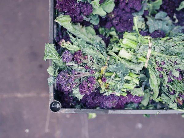 Purple broccoli in box at market — Stock Photo, Image