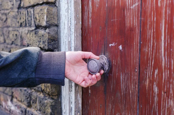 Female hand touching and feeling a knob — Stock Photo, Image