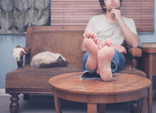 Young man with bare feet resting — Stock Photo, Image