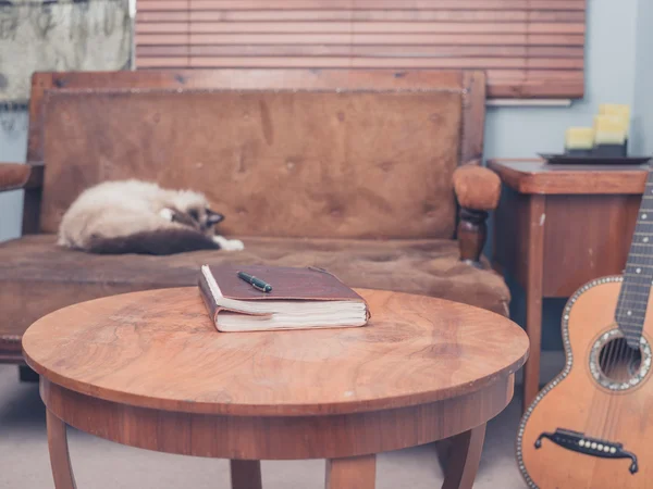 Notebook on coffee table — Stock Photo, Image