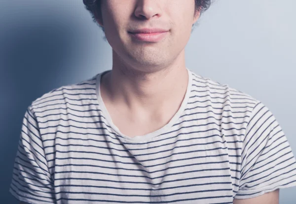 Happy young man is stripey t-shirt — Stock Photo, Image