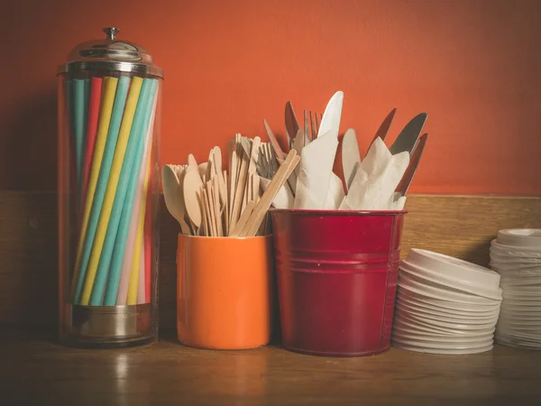 Cutlery straws and plastic lids — Stock Photo, Image