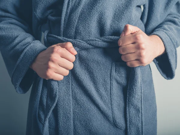Man tying belt on his bathrobe — Stock Photo, Image