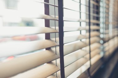 Venetian blinds by the window clipart