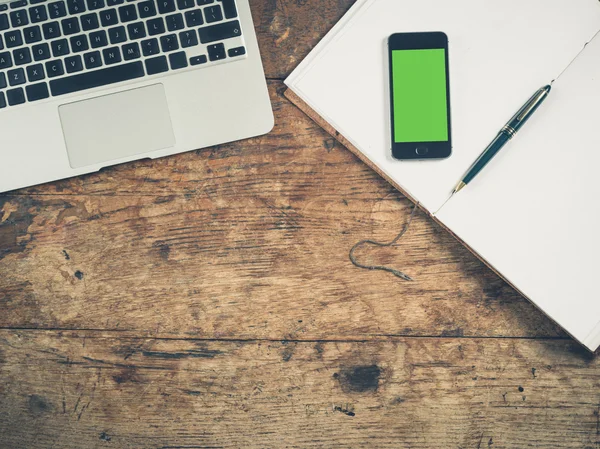 Smart phone concept with notepad and laptop — Stock Photo, Image