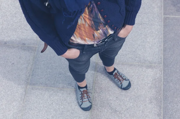 Young woman with hands in pocket outside — Stock Photo, Image