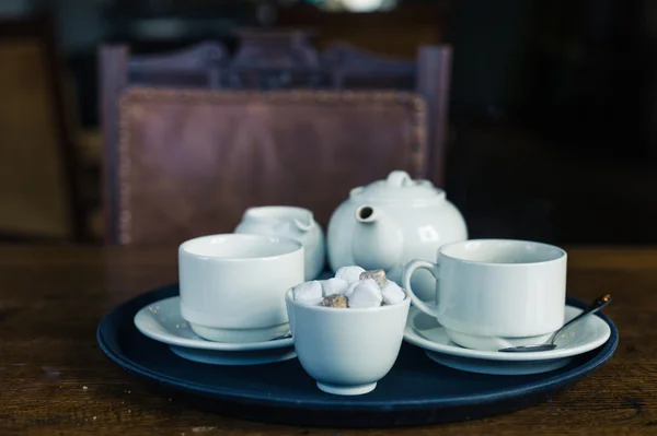 Teapot, cup and sugar on tray — Stock Photo, Image