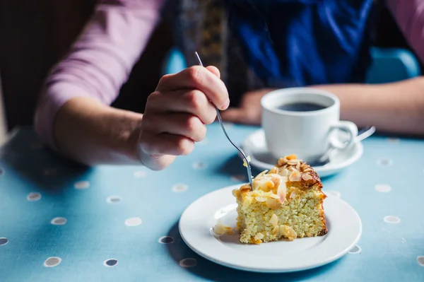Woman having coffee and cake in tearoom — Stock Photo, Image