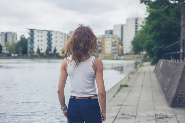 Young woman by marina in urban area — Stock Photo, Image