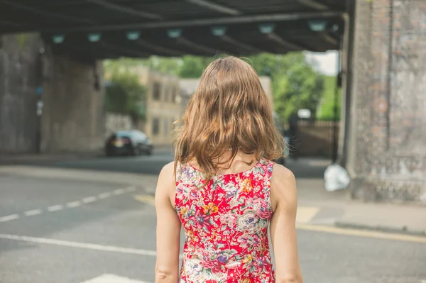 Woman standing in the street — Stock Photo, Image