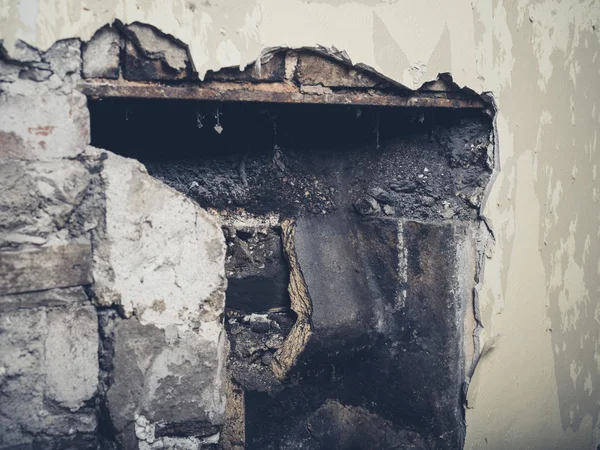 Demolished fireplace in a house — Stock Photo, Image