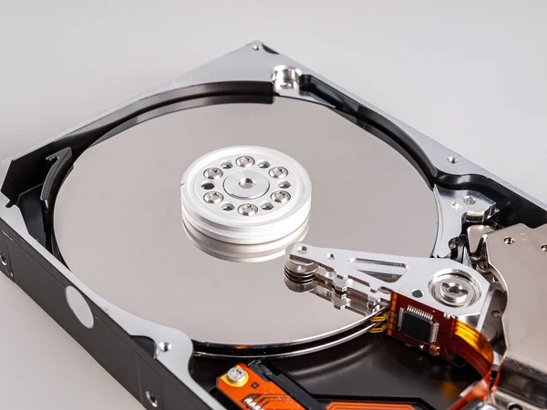 mechanical movable hard disk, with magnetic head in disassembled state, view of the drive hard disk plates, isolated