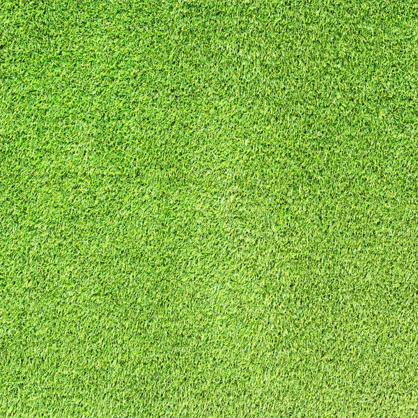背景に緑の人工芝のテクスチャ. — ストック写真