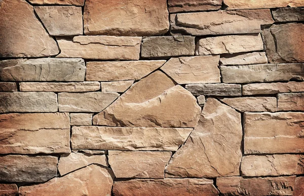 Taş duvar dokusu veya arka plan. Kahverengi renk — Stok fotoğraf