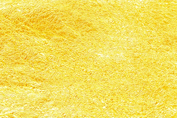 Hoja de oro amarillo brillante textura de la hoja para el fondo. Pliegue . — Foto de Stock