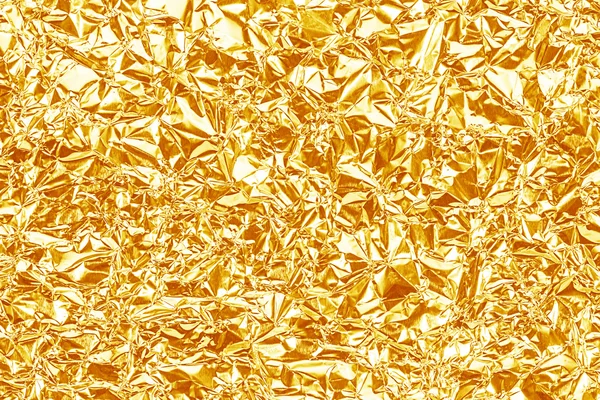 Błyszczący żółty złota folia tekstura tło i cień. Fałdowanie — Zdjęcie stockowe