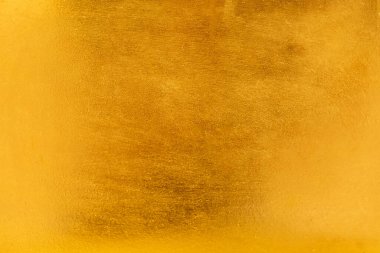 Altın soyut arkaplan veya doku ve gradyan gölgesi.