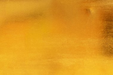 Altın soyut arkaplan veya doku ve gradyan gölgesi.