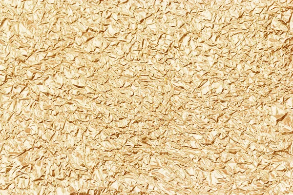 Glanzend blad geel goud folie textuur voor achtergrond — Stockfoto