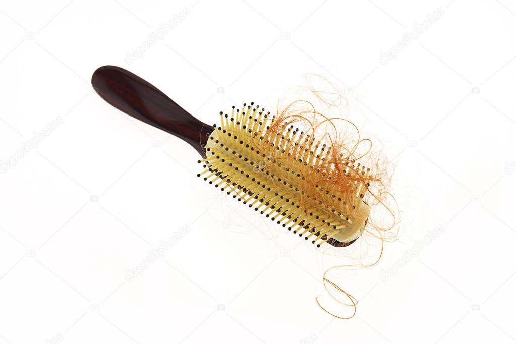 Waman hair loss problem with round hair brush , isolated on whit
