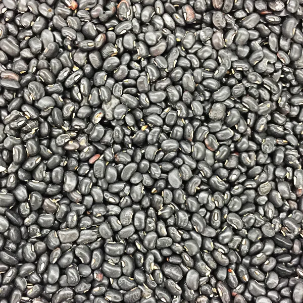 A lot of black beans for background uses — Stock Photo, Image