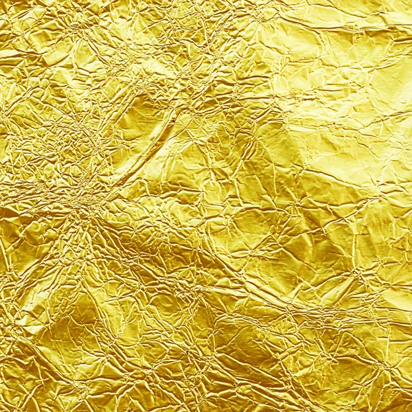 Glänsande Gula löv guld-omkullkastar textur för bakgrund. — Stockfoto