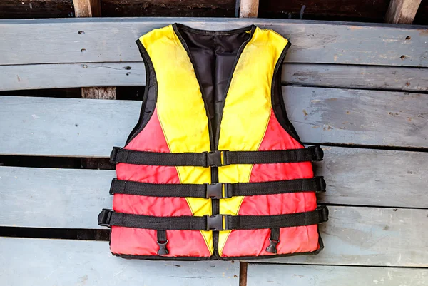 Old life jackets on the floor wooden boat — Stock Photo, Image