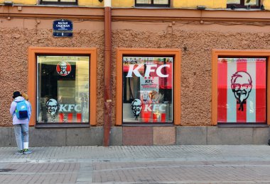 Saint Petersburg, Russia - June 1, 2021: KFC logo and restaurant facade in the street.  clipart