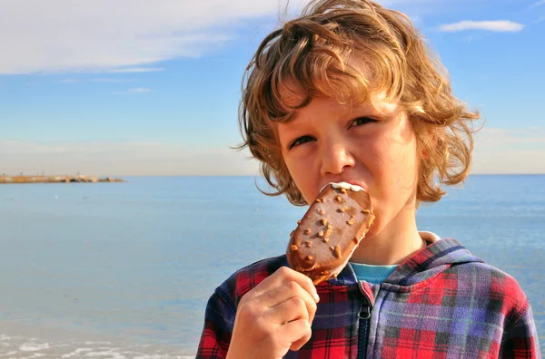 Cheerful boy with an ice-cream — Stock Photo, Image