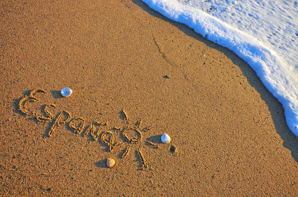 Spanje teken op het strand — Stockfoto