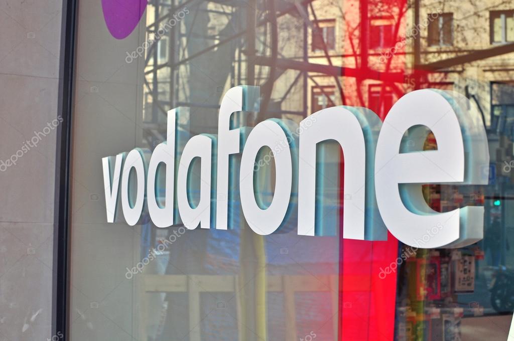 BARCELONA, SPAIN - FEBRUARY 5: Logo of Vodafone company in the shop on February 5, 2015. Vodafone is a British multinational telecommunications company.