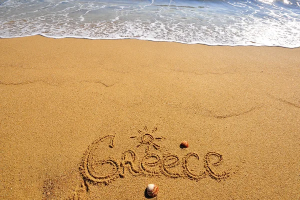 Görögország jele a strandon — Stock Fotó