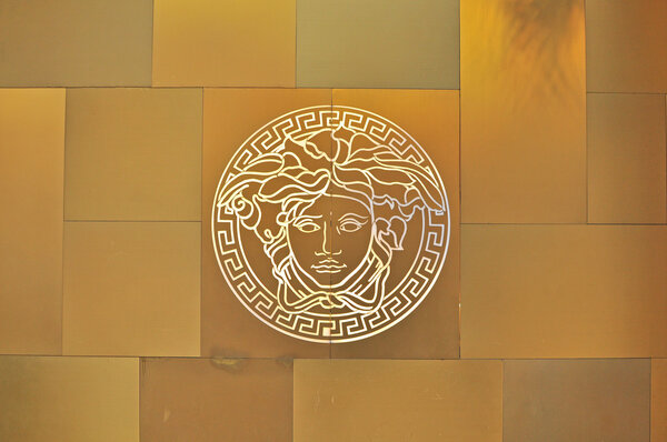 Versace logo on golden background