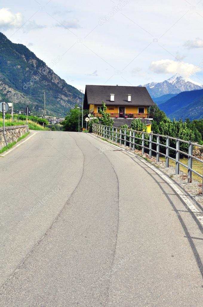 Yellow house in Alps