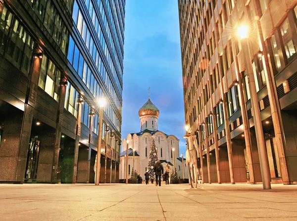 Old orthodox church between office centres in Moscow downtown — Stock Photo, Image