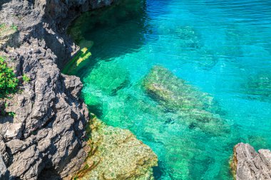 view of cliffs rocks above great Cyprus lake tranquil turquoise water at beautiful gorgeous Bruce Peninsula, Ontario