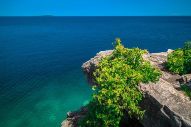 view of cliff hanging  above gorgeous Cyprus lake at bruse Peninsula, Ontario