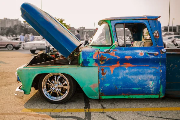 Perfect gorgeous side view of old stained rusty, dirty old classic vintage retro pickup truck with open hood — Stockfoto