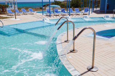 amazing inviting gorgeous view of outdoor spa landscape and grounds with natural sea water pool and beach beds