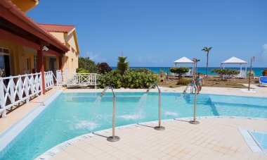 partial amazing view of beautiful inviting outdoor spa swimming pool and grounds