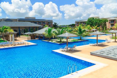 gorgeous beautiful view of swimming pool, tranquil turquoise azure water and tropical garden