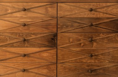 great amazing beautiful view of old vintage, retro classic wooden drawer dresser with wooden Knobs background