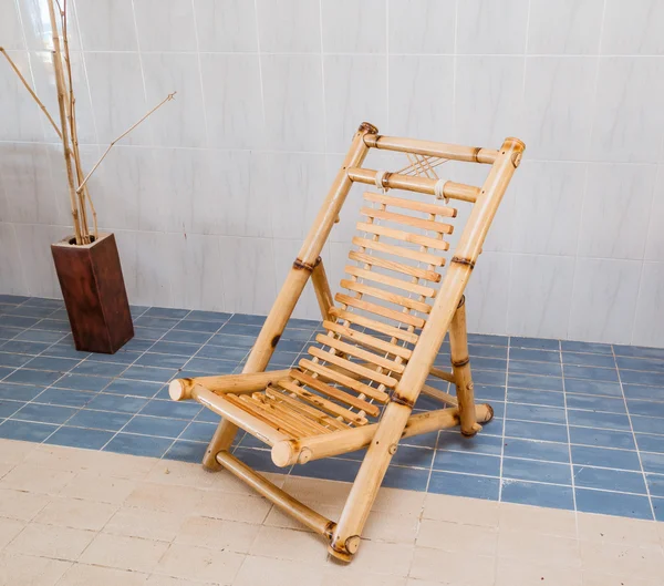 Amazing beautiful stylish natural bamboo chair standing on blue and biege  ceramic floor — Stock Photo, Image