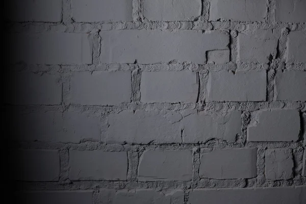회색 벽돌 벽 가까이 스톡 사진