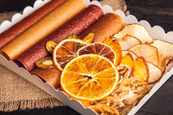 Sweet fruit snacks in a package - pastilles and dried fruit. Fruit candy, Sugar Free, healthy nutrition