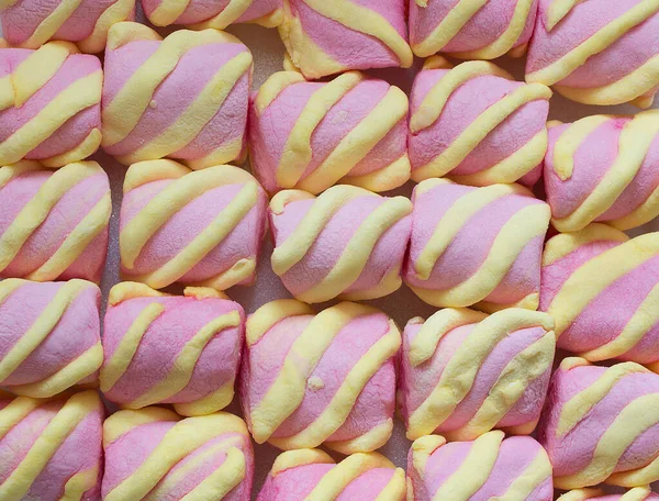 Top view on background texture of colorful marshmallow candies. Sweets of corn syrup, gelatin, sugar, and starch. — Stock Photo, Image